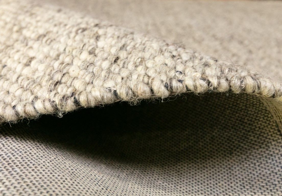 Park Lane Smoke is a contemporary hand woven flatweave rug. Made from 80%  New Zealand Wool and 20% polyester for a soft and slightly textured feel. Colour Smokey Grey. Sizes 155 X 225, 200 X 290, 240 X 320 and 300 X 400. Side.