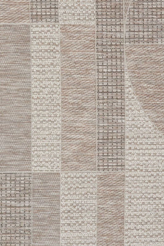 The Patio Arcs Linen indoor/outdoor rug featuring neutral tones and a modern designed pattern, power-loomed from UV-stabilised polypropylene for lasting durability. Colours, Linen, Beiges and hints of light grey. 3 sizes. Close.