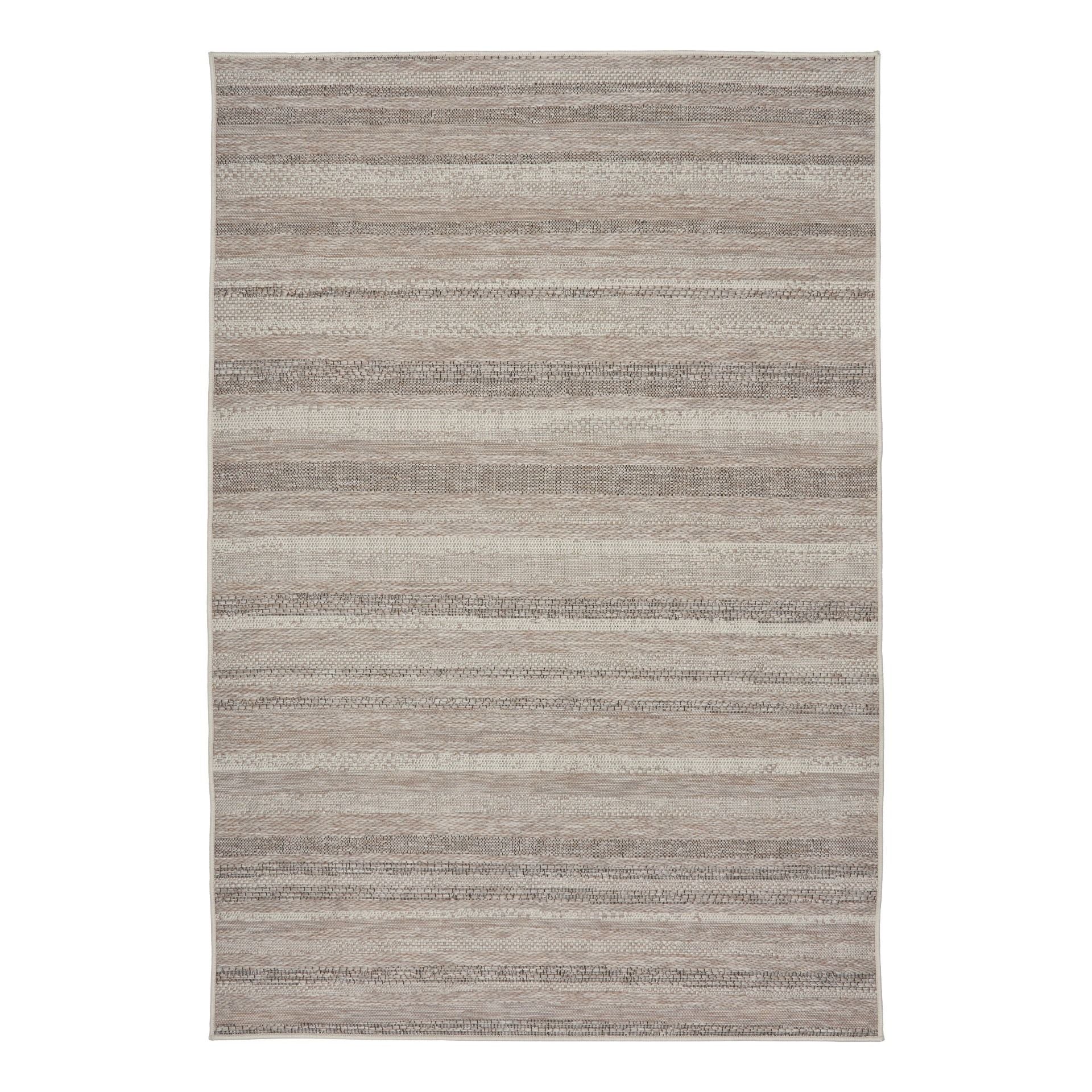 The Patio Linear Linen indoor/outdoor rug featuring neutral tones and a subtle textured pattern, power-loomed from UV-stabilised polypropylene for lasting durability. Colours, Linen, Beiges and hints of black. 3 sizes. Top.