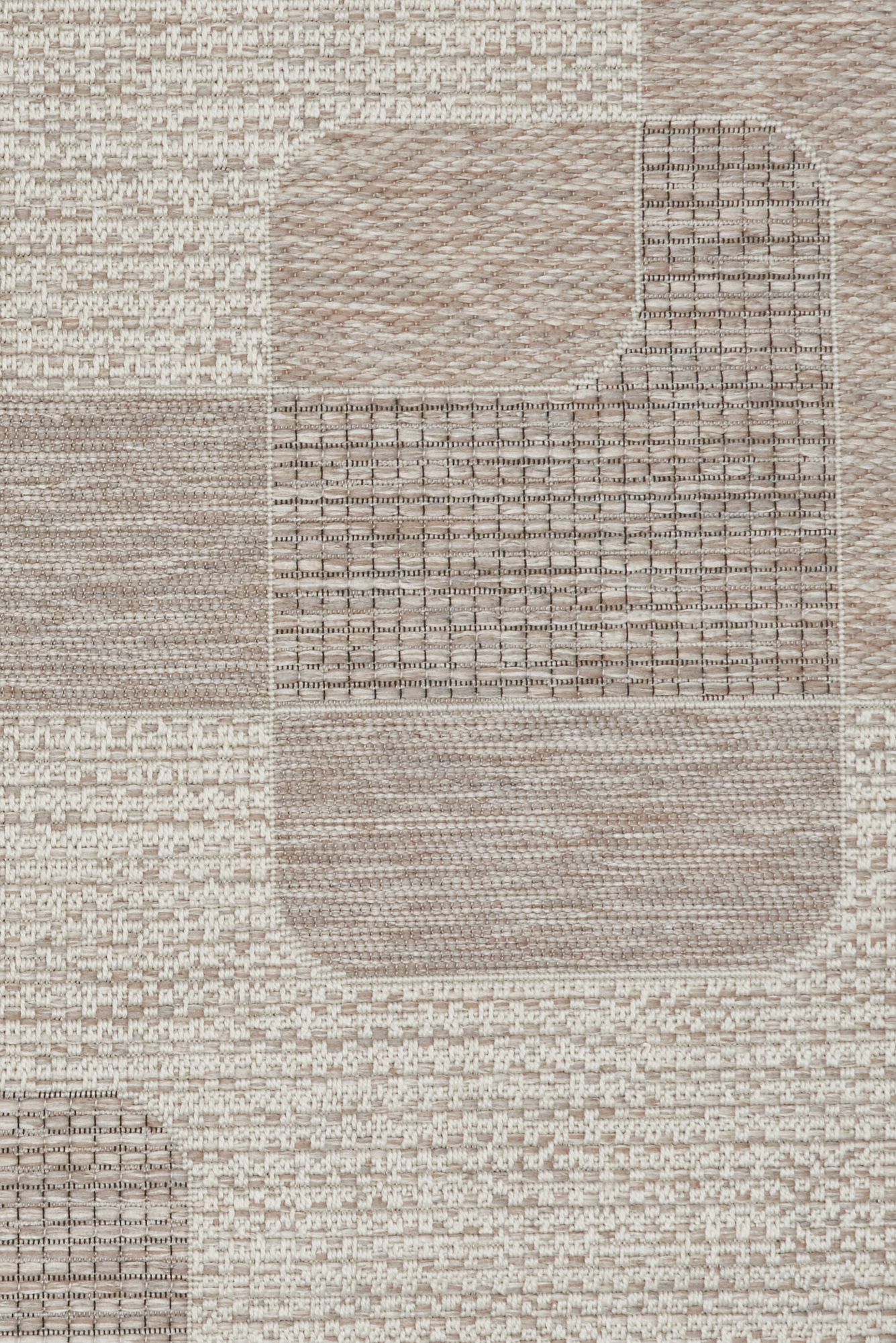 The Patio Linen 50005 indoor/outdoor rug featuring neutral tones and a modern designed pattern, power-loomed from UV-stabilised polypropylene for lasting durability. Colours, Linen, Beiges and hints of light grey. 3 sizes. Close.