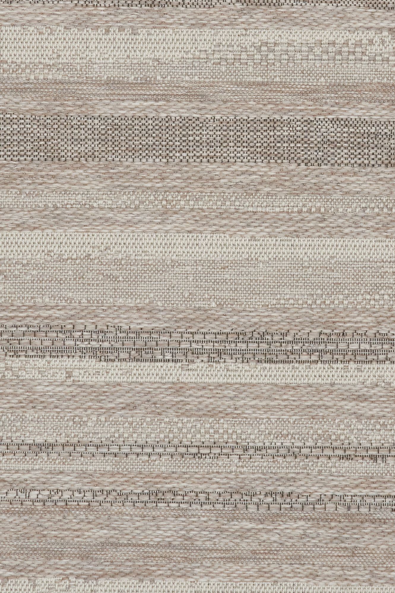 The Patio Linen 900 indoor/outdoor rug featuring neutral tones and a subtle textured pattern, power-loomed from UV-stabilised polypropylene for lasting durability. Colours, Linen, Beiges and hints of black. 3 sizes. Close.