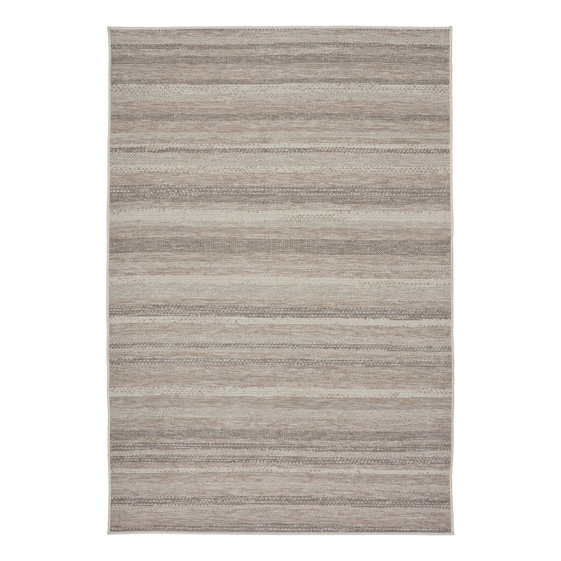 The Patio Linen 900 indoor/outdoor rug featuring neutral tones and a subtle textured pattern, power-loomed from UV-stabilised polypropylene for lasting durability. Colours, Linen, Beiges and hints of black. 3 sizes. Top.