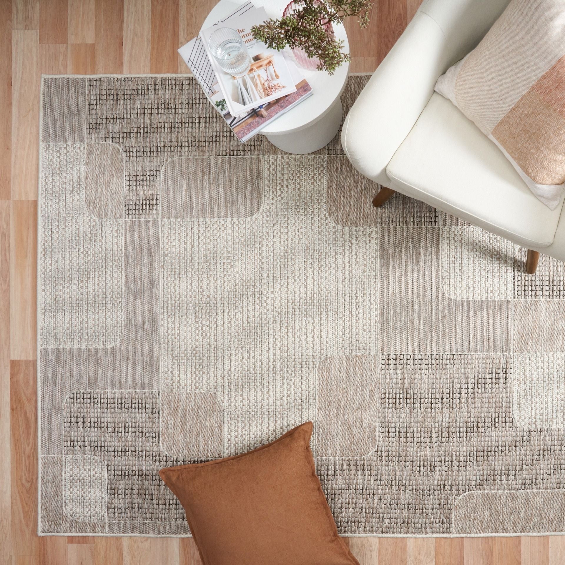 The Patio Squares Linen indoor/outdoor rug featuring neutral tones and a modern designed pattern, power-loomed from UV-stabilised polypropylene for lasting durability. Colours, Linen, Beiges and hints of light grey. 3 sizes. Life.