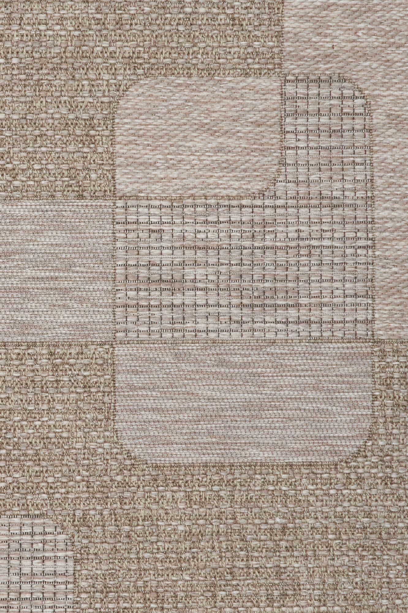 The Patio Straw 50005 indoor/outdoor rug featuring neutral tones and a modern designed pattern, power-loomed from UV-stabilised polypropylene for lasting durability. Colours, Linen, Beiges and hints of light grey. 3 sizes. Close.