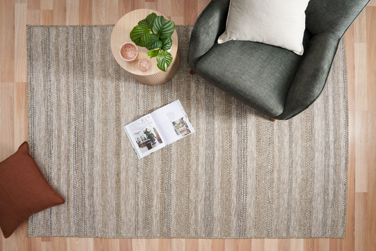 The Patio Straw 900 indoor/outdoor rug featuring neutral tones and a subtle textured pattern, power-loomed from UV-stabilised polypropylene for lasting durability. Colour Browns, Beiges and hints of black. 3 sizes. Life.