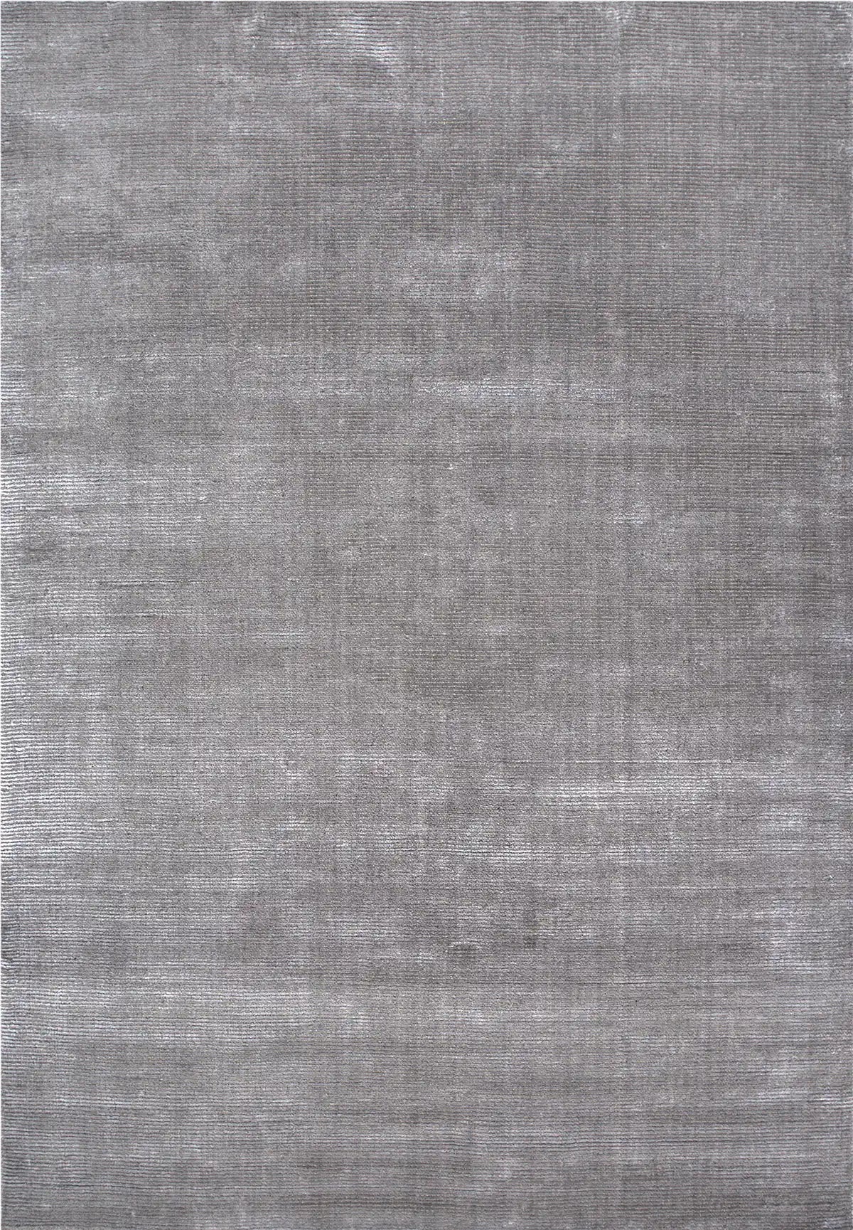 Pearl Grace is a luxurious hand-loomed knotted rug made with wool and silky viscose. It boasts a ribbed texture and pile height of 12-14mm. Colour Silver Grey. Sizes 160 X 230, 200 X 290 and 240 X 340. Full.