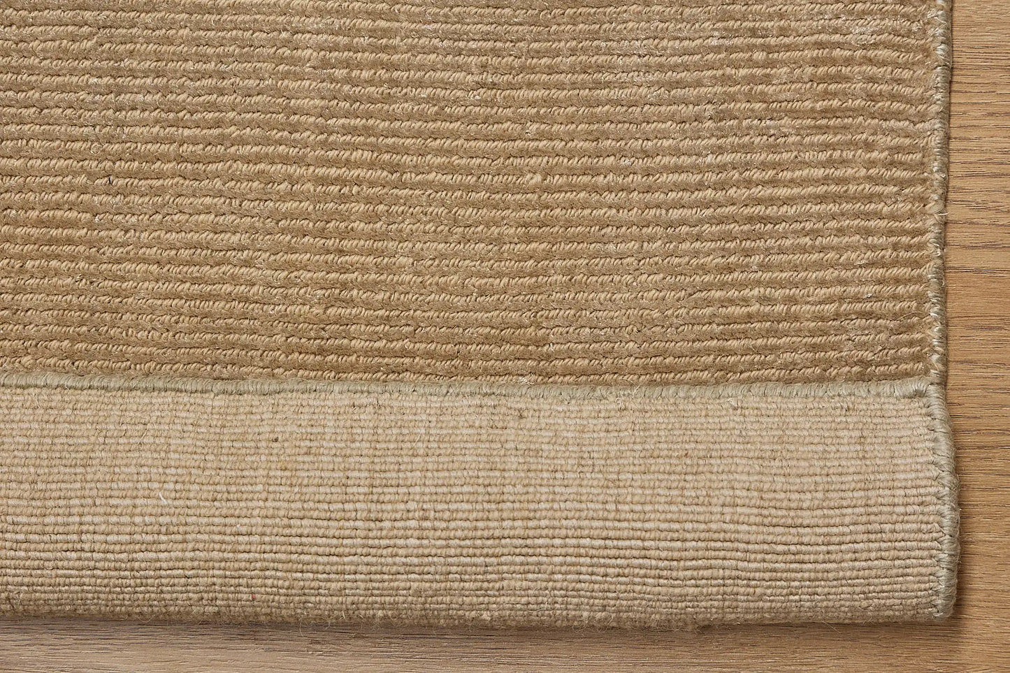 Pearl Olive is a luxurious hand-loomed knotted rug made with wool and silky viscose. It boasts a ribbed texture and pile height of 12-14mm. Colour light olive green. Sizes 160 X 230, 200 X 290 and 240 X 340. Fold
