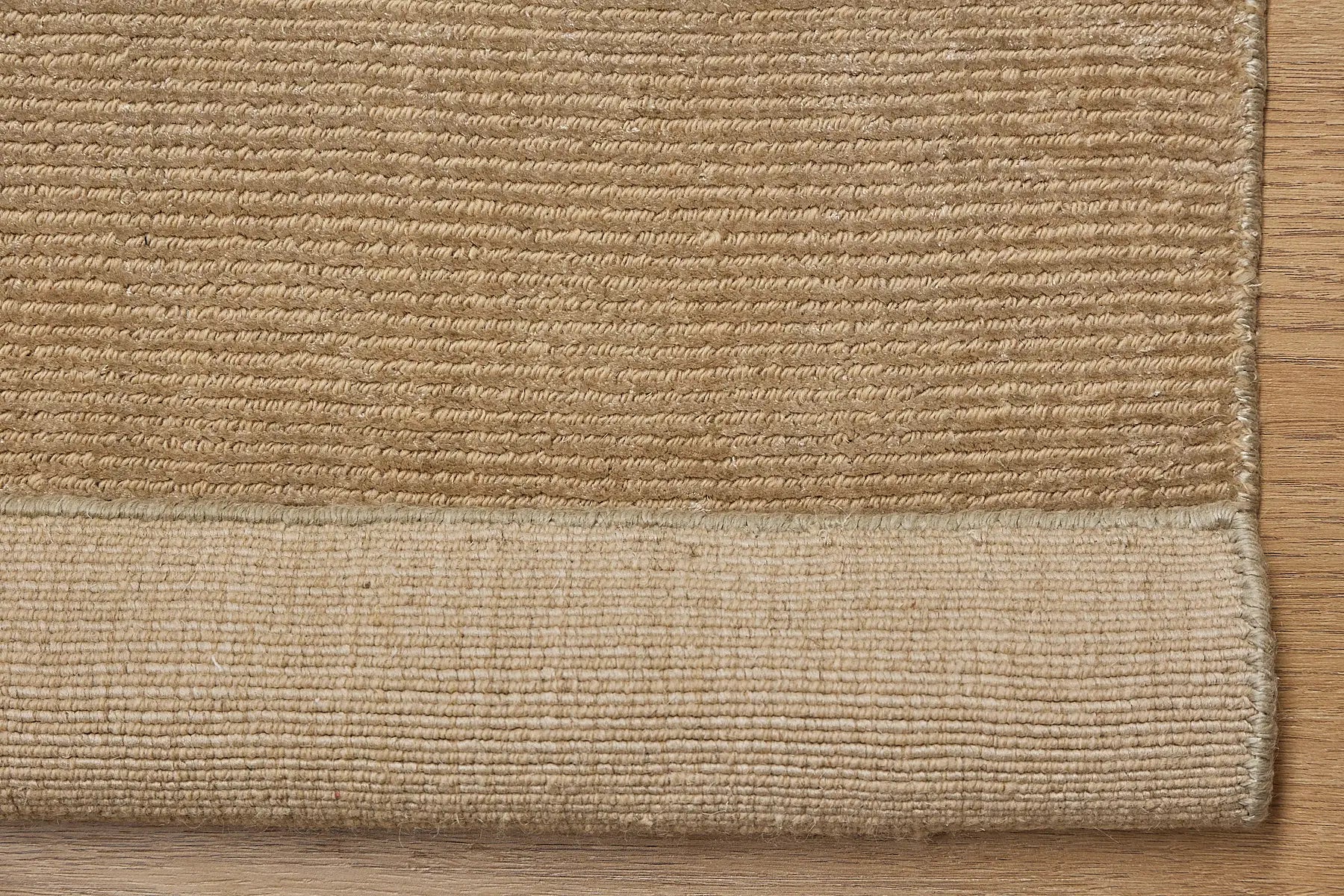 Pearl Olive is a luxurious hand-loomed knotted rug made with wool and silky viscose. It boasts a ribbed texture and pile height of 12-14mm. Colour light olive green. Sizes 160 X 230, 200 X 290 and 240 X 340. Fold