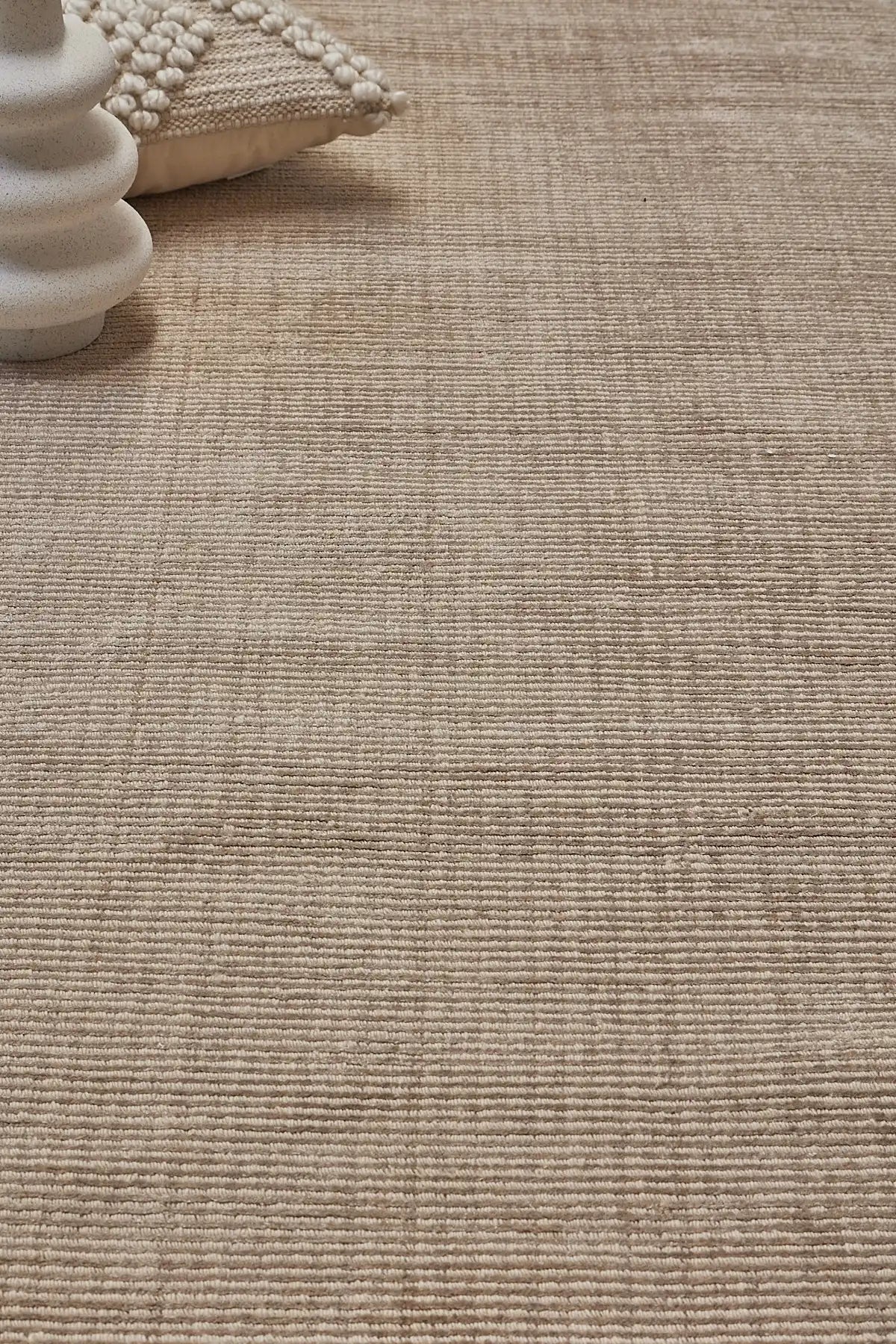 Pearl Olive is a luxurious hand-loomed knotted rug made with wool and silky viscose. It boasts a ribbed texture and pile height of 12-14mm. Colour light olive green. Sizes 160 X 230, 200 X 290 and 240 X 340. Life.