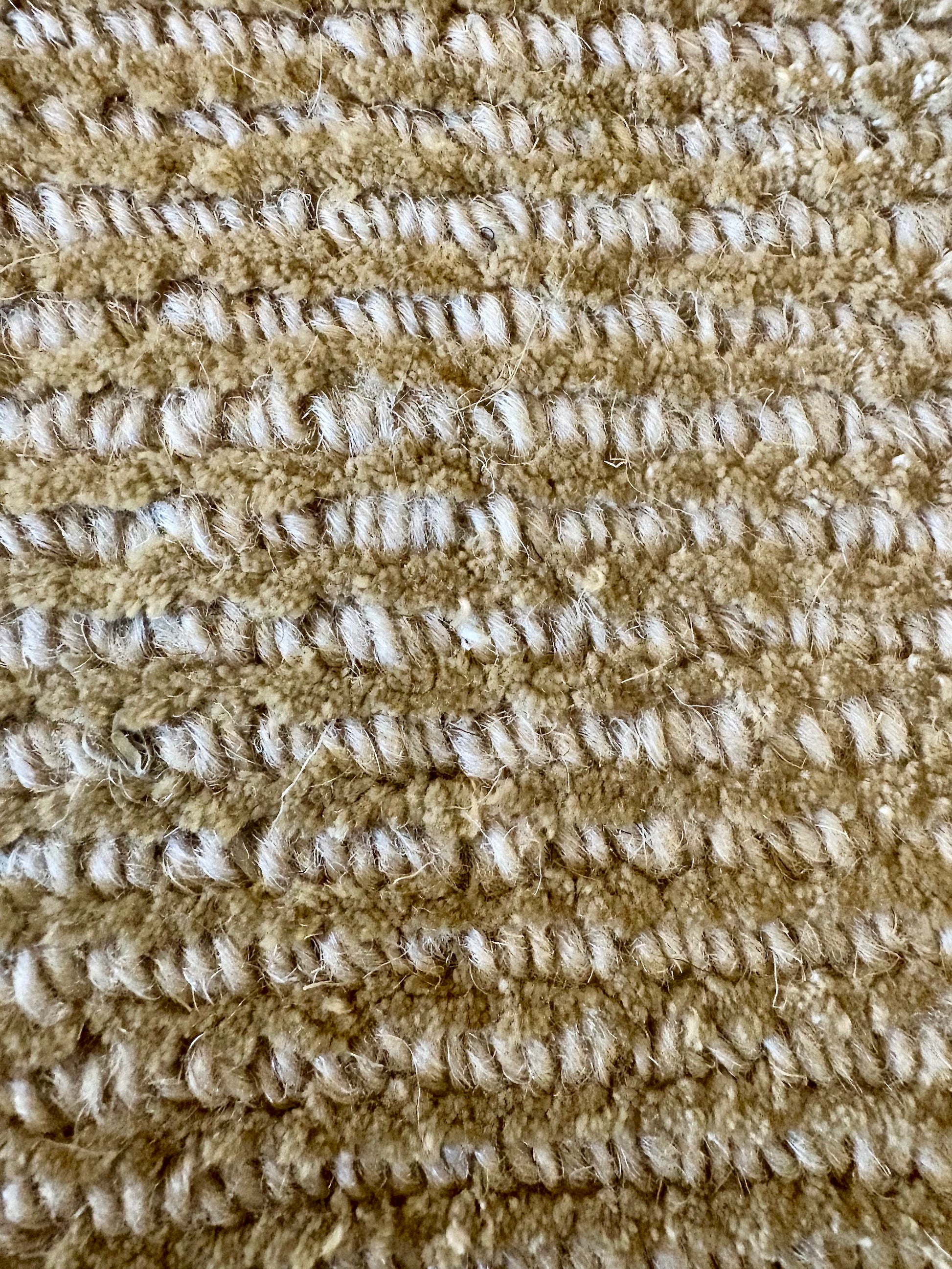 Pearl Olive is a luxurious hand-loomed knotted rug made with wool and silky viscose. It boasts a ribbed texture and pile height of 12-14mm. Colour light olive green. Sizes 160 X 230, 200 X 290 and 240 X 340. Close.