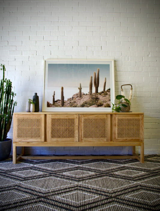 The Pendleton 4 door buffet features four rattan mesh doors and is made from sustainable white cedar. Colour natural. Measures 1800 length X 400 depth X 700 height. Front Styled.