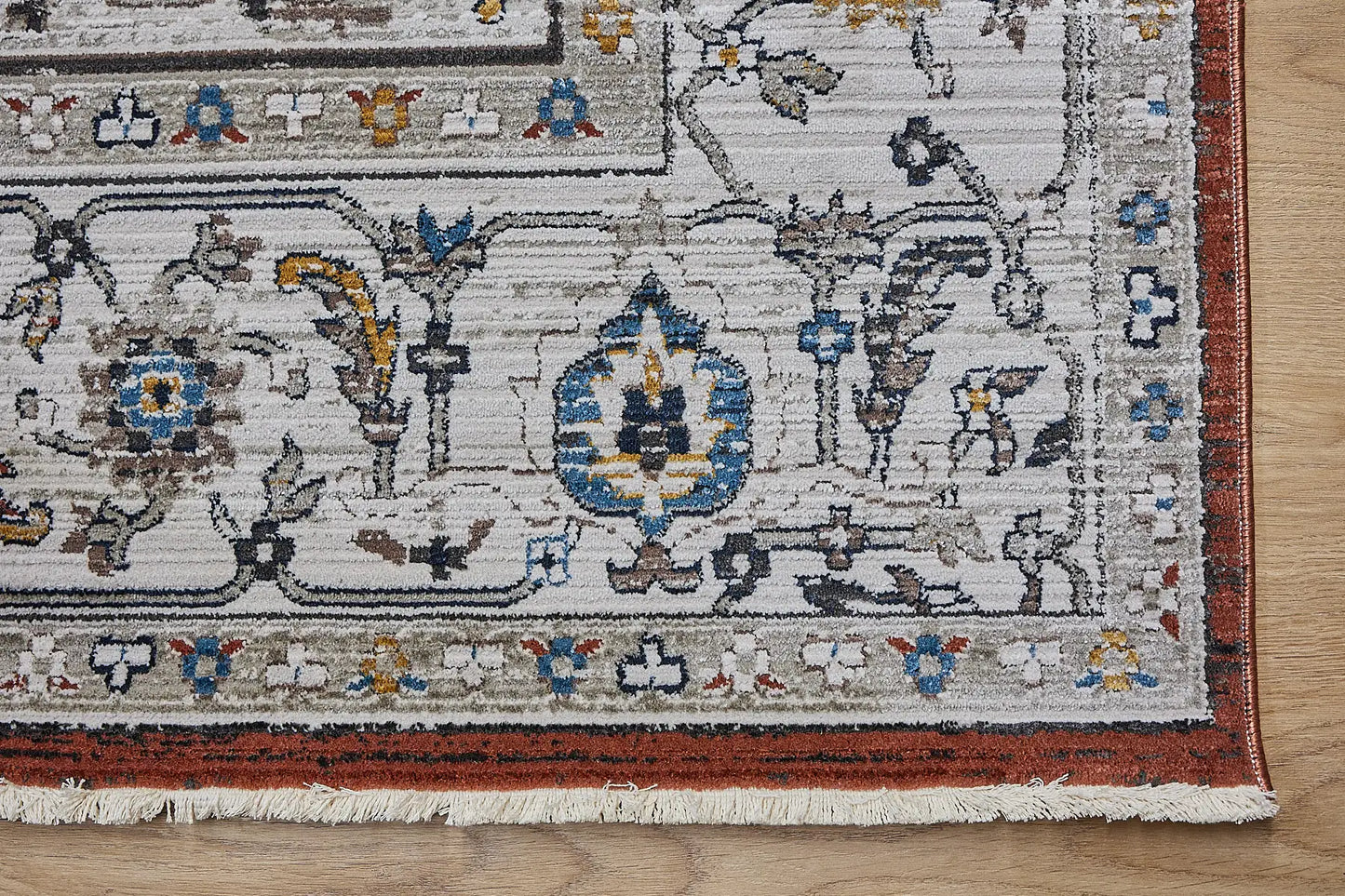 Persia Rust is a machine made traditional designed rug crafted from luxurious polyester for soft feel.  It has a 7-9mm Pile height. Colours beige with rust red and blue accents. Sizes 160 X 230, 200 X 290, 240 X 340 and 300 X 400. Corner.