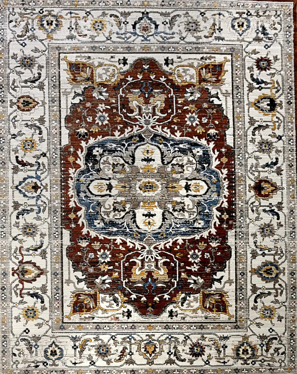 Persia Rust is a machine made traditional designed rug crafted from luxurious polyester for soft feel.  It has a 7-9mm Pile height. Colours beige with rust red and blue accents. Sizes 160 X 230, 200 X 290, 240 X 340 and 300 X 400. Full.