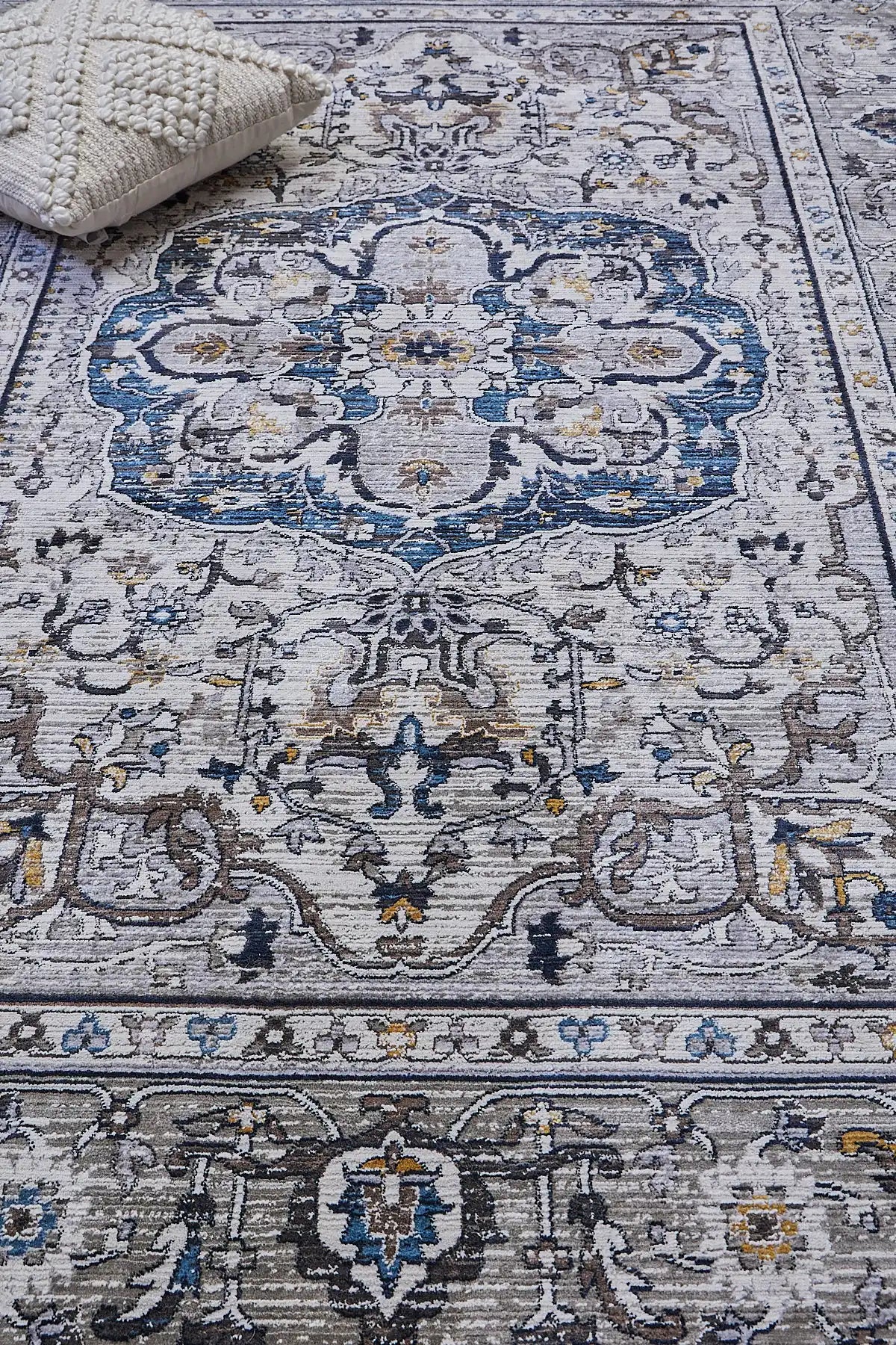 Persia Taupe is a machine made traditional designed rug crafted from luxurious polyester for soft feel.  It has a 7-9mm Pile height. Colours grey with beige and blue accents. Sizes 160 X 230, 200 X 290, 240 X 340 and 300 X 400. Life.