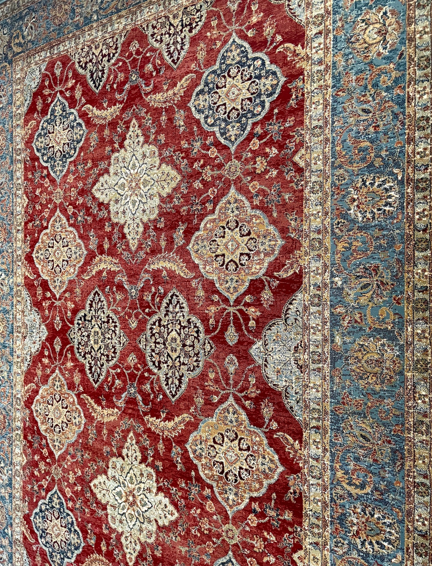 A close view of a polypropylene traditional machine made rug.