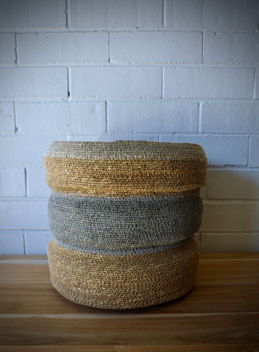 The Port Seagrass Basket - Medium, is crafted from natural seagrass.  Its weave creates a rustic texture, perfect for storing most things. Colours, Natural and Steel. Measures 28 Diameter X 28 Height. Side.
