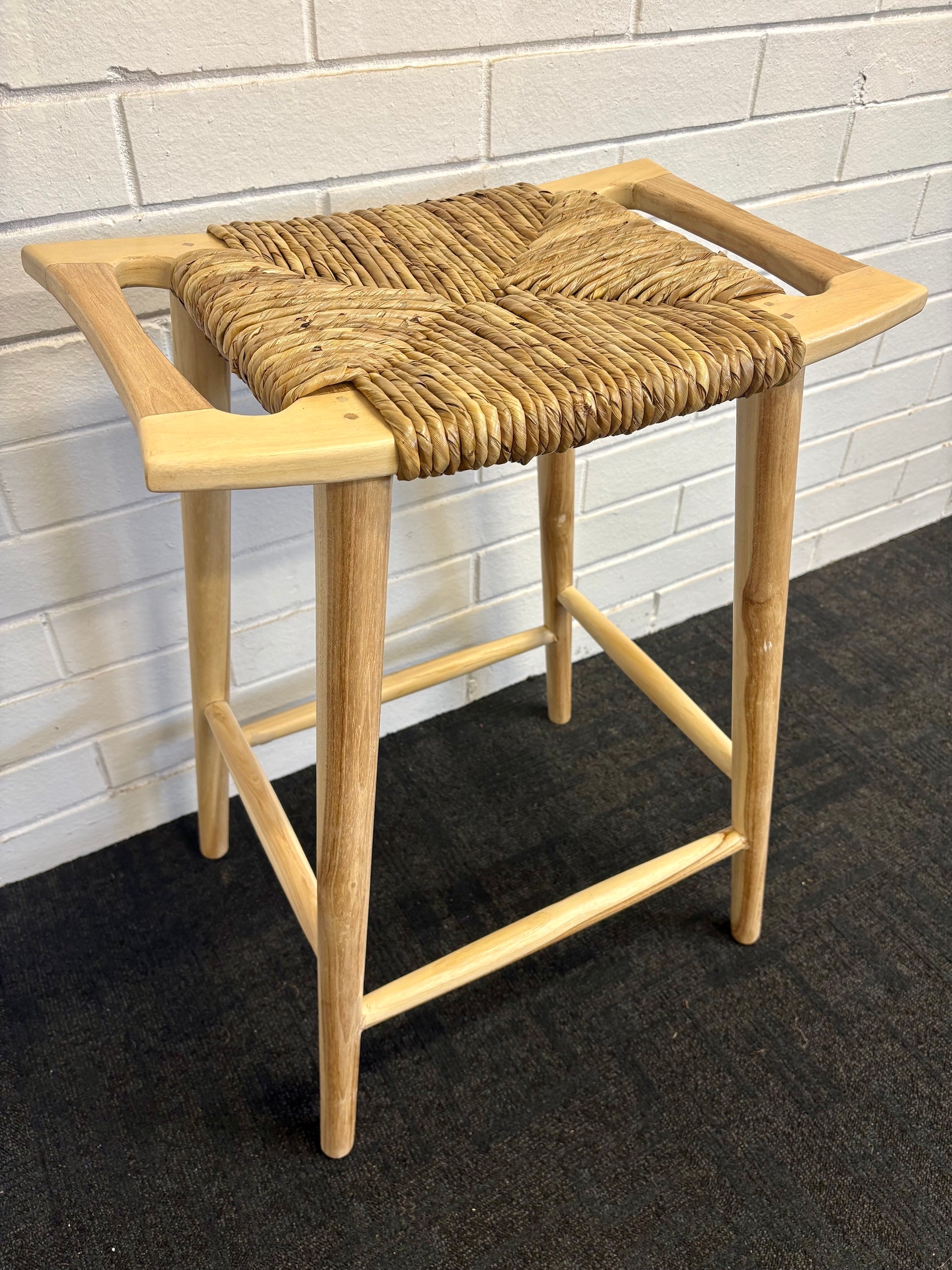 The Potomac Barstool gives a coastal contemporary vibe. Crafted from a sustainable teak frame, the seat is made of durable synthetic pandan rope. Colour natural. Measures 560 wide X 360 depth X 680 height. Side Angle.