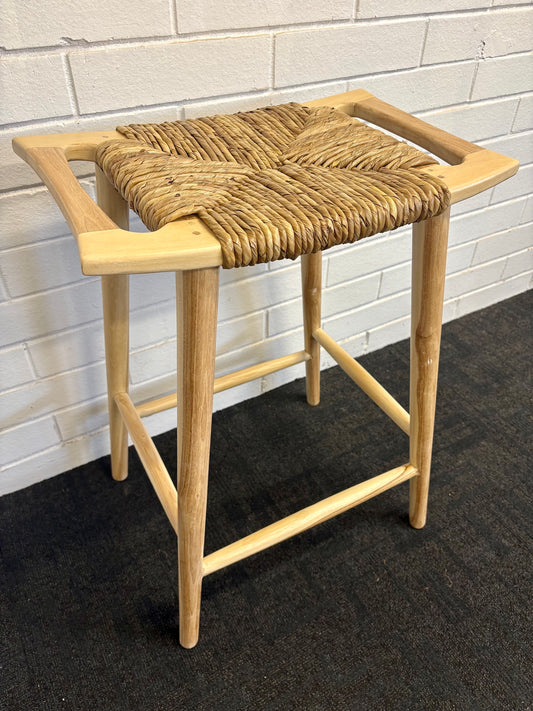 The Potomac Barstool gives a coastal contemporary vibe. Crafted from a sustainable teak frame, the seat is made of durable synthetic pandan rope. Colour natural. Measures 560 wide X 360 depth X 680 height. Side Angle.