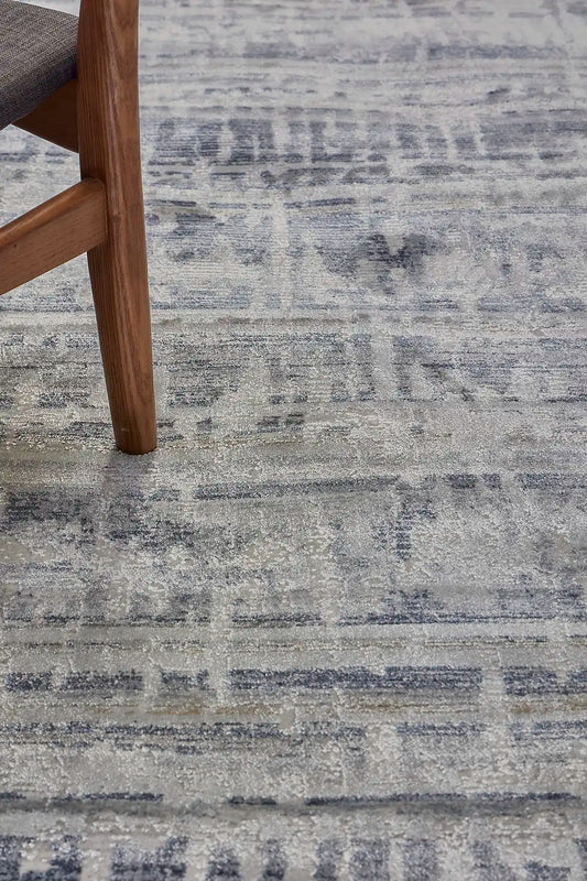 Raj Aqua is a machine made rug. Its design boasts a modern/contemporary feel. Crafted from Viscose and Polyester, with a low-profile 7-9mm pile height. Colours Blue,Grey and Light Grey tones. Sizes 160 X 230, 200 X 290, 240 X 340 and 300 X 400. Life.