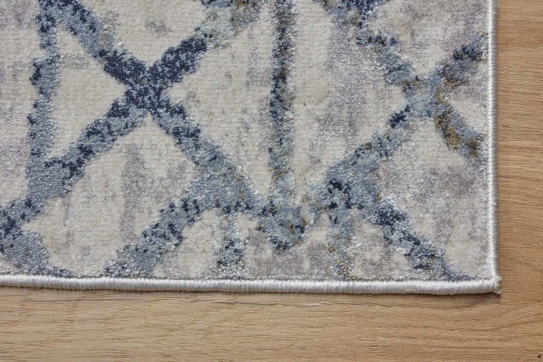 Raj Blue is a machine made rug. Its design boasts a geometric modern/contemporary feel. Crafted from Viscose and Polyester, with a low-profile 7-9mm pile height. Colours Blue,Grey and Light Grey tones. Sizes 160 X 230, 200 X 290, 240 X 340 and 300 X 400. Corner.