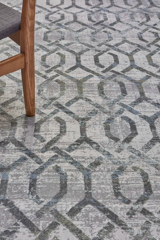 Raj Silver is a machine made rug. Its design boasts a geometric modern/contemporary feel. Crafted from Viscose and Polyester, with a low-profile 7-9mm pile height. Colours Light Grey with grey and beige/white accents. Sizes 160 X 230, 200 X 290, 240 X 340 and 300 X 400. Life.