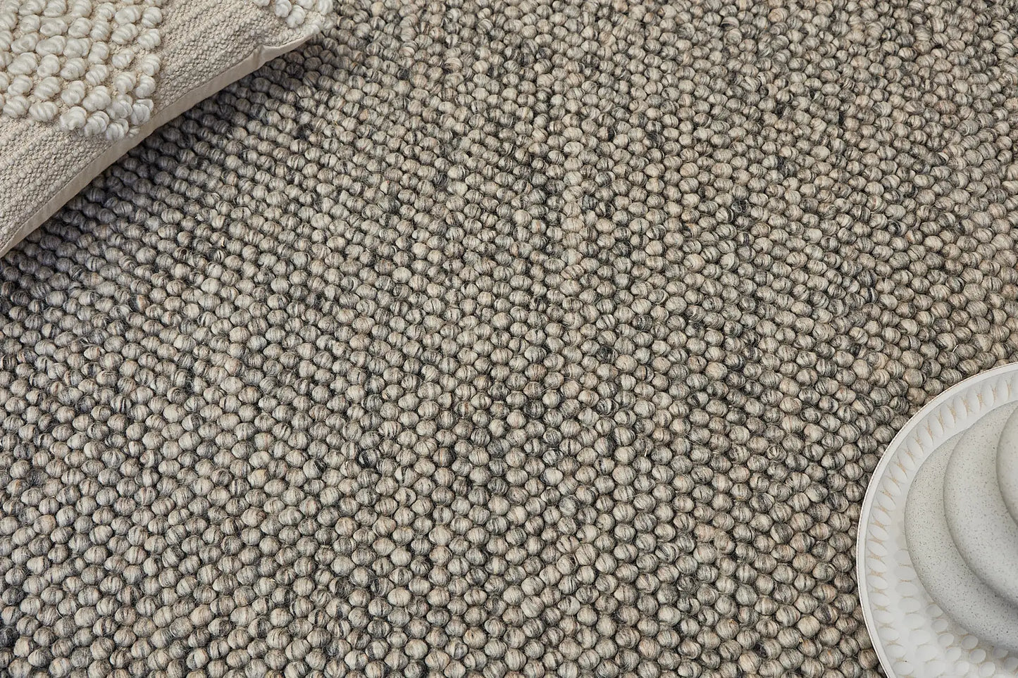 Rocks Grey is a luxurious hand-woven wool carpet. Boasting a plush loop pile with 8-18mm pile height. Colour Grey with Dark grey accents. Sizes 160 X 230, 200 X 290, 240 X 340 and 290 X 390. Life.