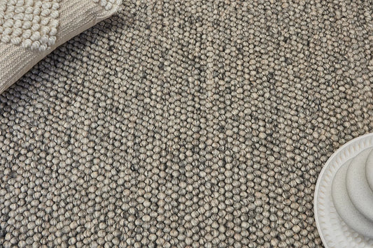 Rocks Grey is a luxurious hand-woven wool carpet. Boasting a plush loop pile with 8-18mm pile height. Colour Grey with Dark grey accents. Sizes 160 X 230, 200 X 290, 240 X 340 and 290 X 390. Life.
