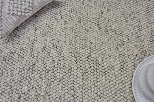 Rocks White is a luxurious hand-woven wool carpet. Boasting a plush loop pile with 8-18mm pile height. Colour White with grey accents. Sizes 160 X 230, 200 X 290, 240 X 340 and 290 X 390. Life.
