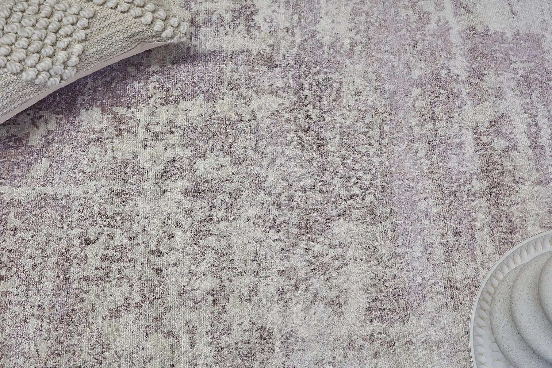 Close view of a hand woven viscose piled rug.