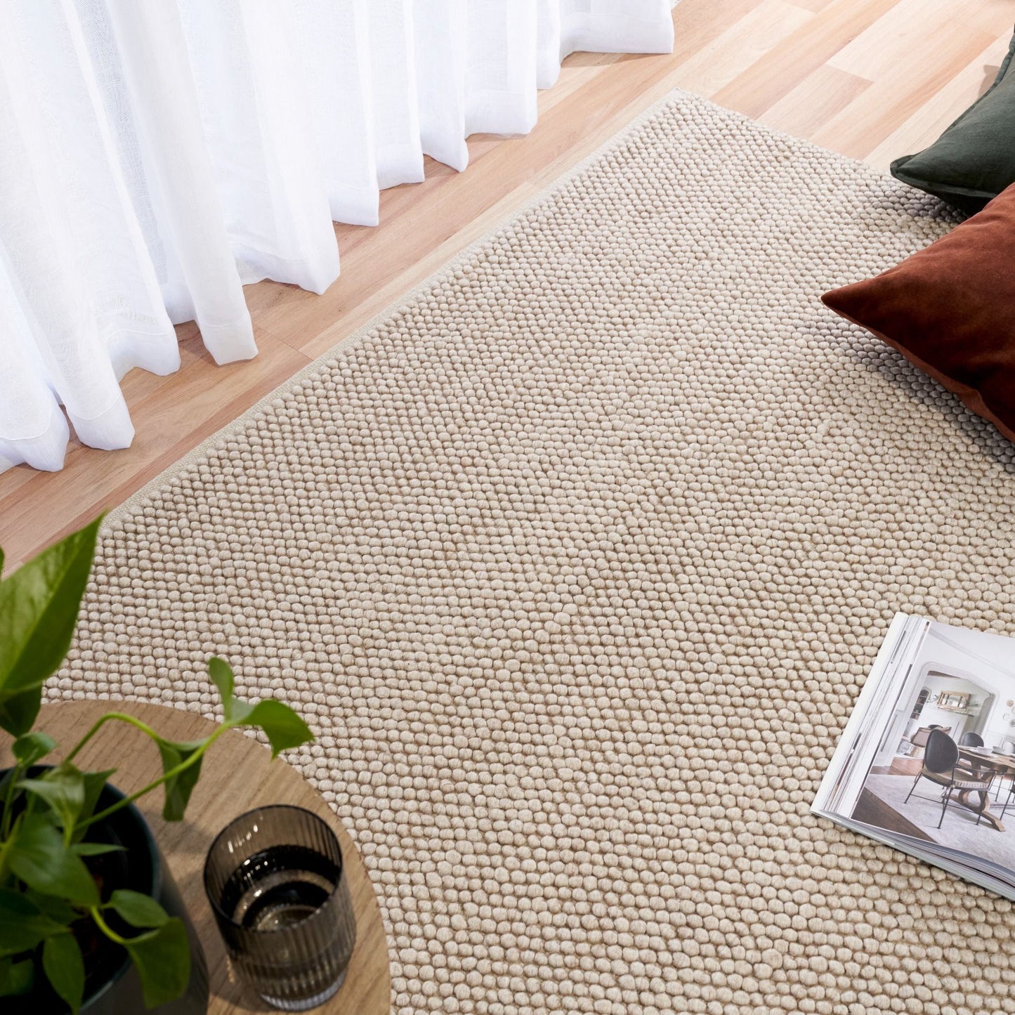 Rusta Beige hand-woven wool rug featuring a looped pile textured design in soft neutral beige tones, ideal for modern and contemporary interiors. Sizes 155 X 225, 200 X 290, 240 X 320 and 300 X 400. Life.