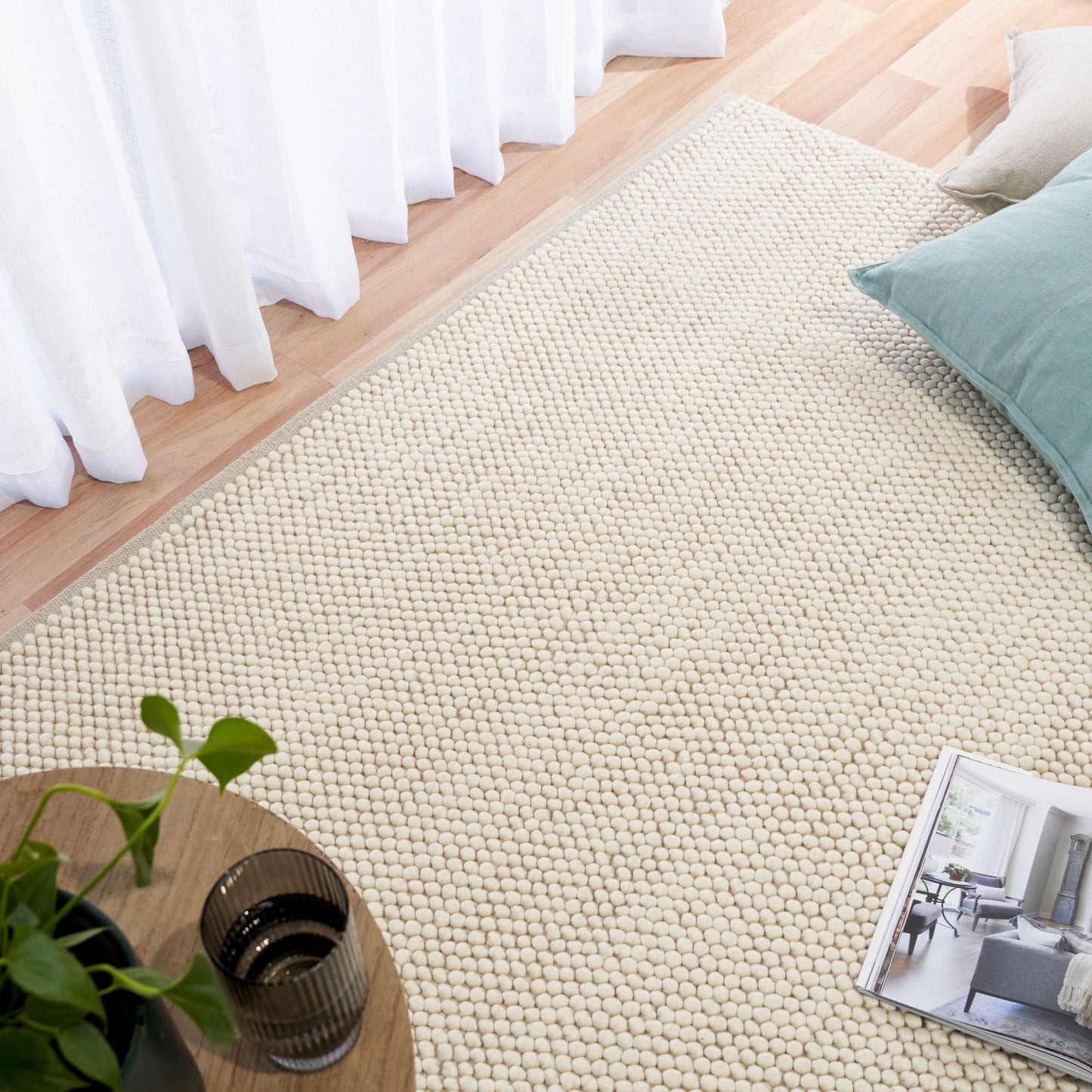 Rusta Cream hand-woven wool rug featuring a looped pile textured design in soft neutral cream tones, ideal for modern and contemporary interiors. Sizes 155 X 225, 200 X 290, 240 X 320 and 300 X 400. Life.