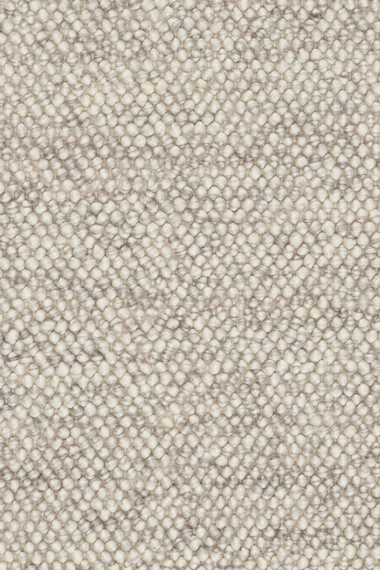 Rusta Silver hand-woven wool rug featuring a looped pile textured design in soft silver tones, ideal for modern and contemporary interiors. Sizes 155 X 225, 200 X 290, 240 X 320 and 300 X 400. Close.