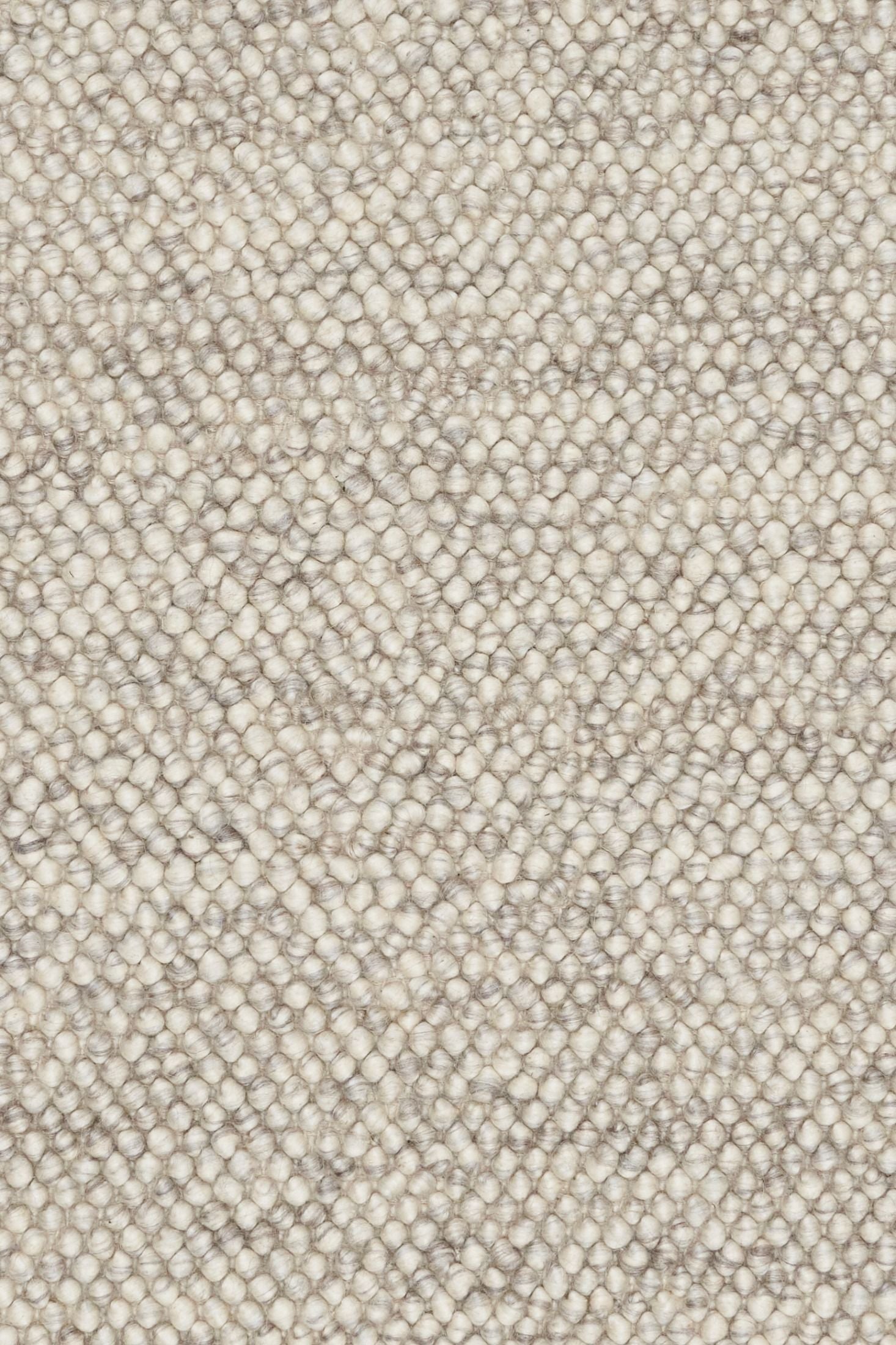 Rusta Silver hand-woven wool rug featuring a looped pile textured design in soft silver tones, ideal for modern and contemporary interiors. Sizes 155 X 225, 200 X 290, 240 X 320 and 300 X 400. Close.