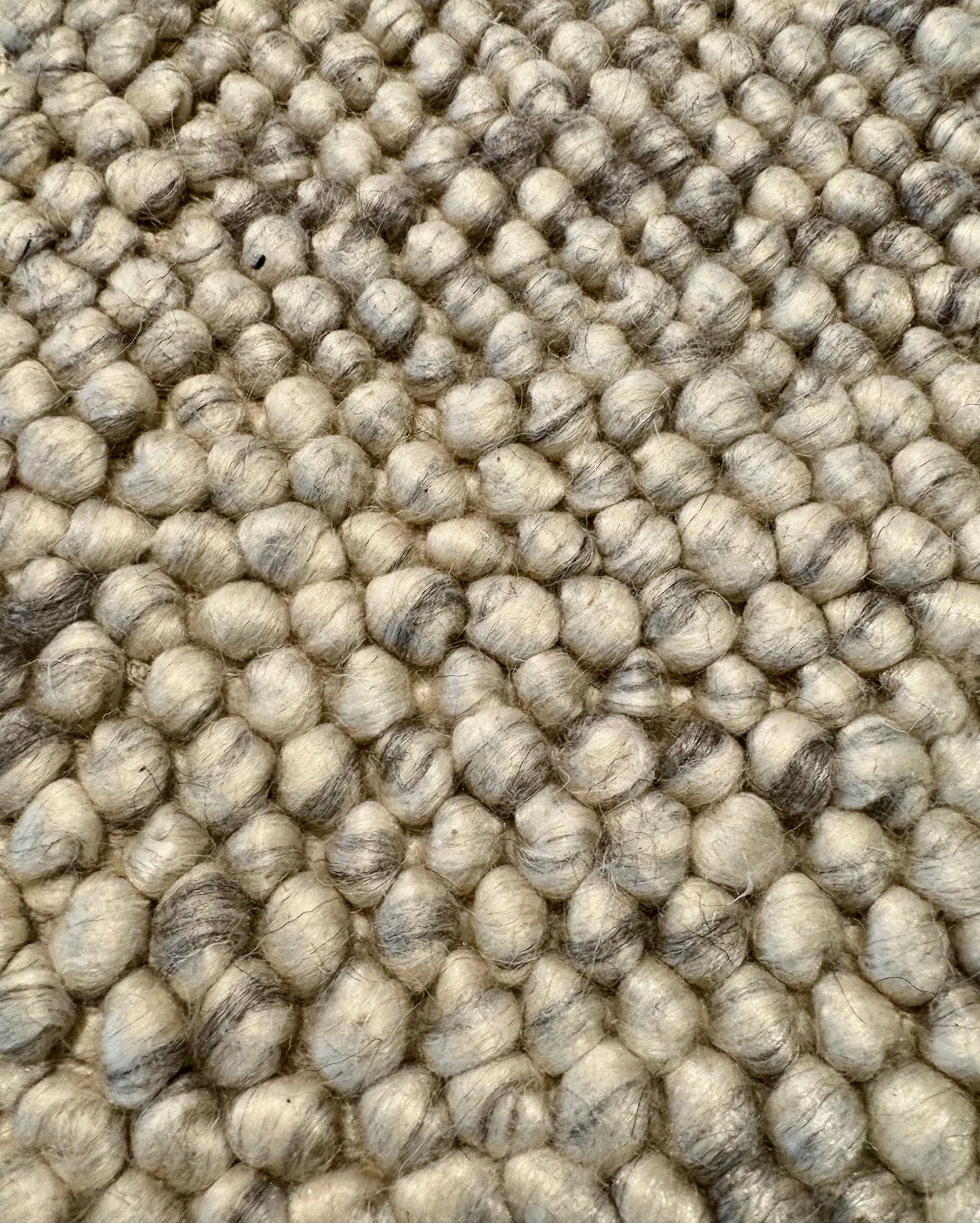 Rusta Silver hand-woven wool rug featuring a looped pile textured design in soft silver tones, ideal for modern and contemporary interiors. Sizes 155 X 225, 200 X 290, 240 X 320 and 300 X 400. Fibres Close.