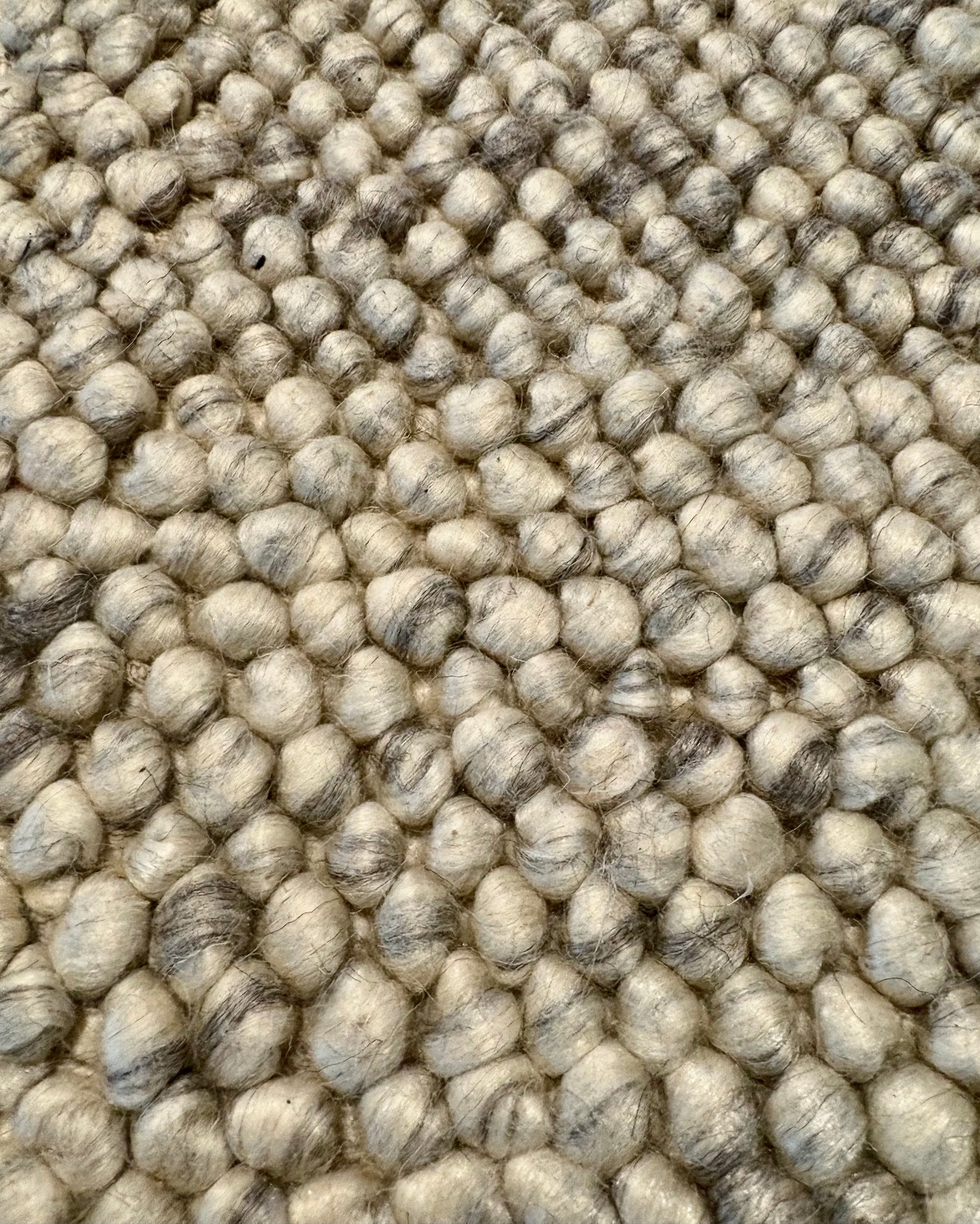 Rusta Silver hand-woven wool rug featuring a looped pile textured design in soft silver tones, ideal for modern and contemporary interiors. Sizes 155 X 225, 200 X 290, 240 X 320 and 300 X 400. Fibres Close.
