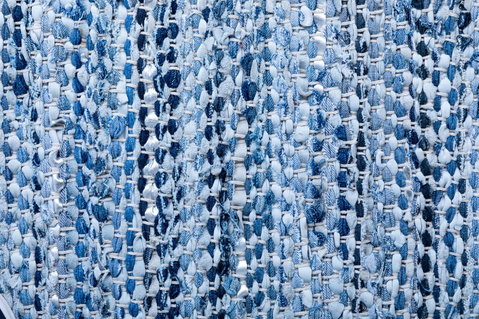 Rustic Charm Blue is a hand woven natural jute and leather carpet.  Colour Light Blue and Blue. Sizes 155 X 225, 200 X 290, 240 X 320 and 300 X 400. Close.