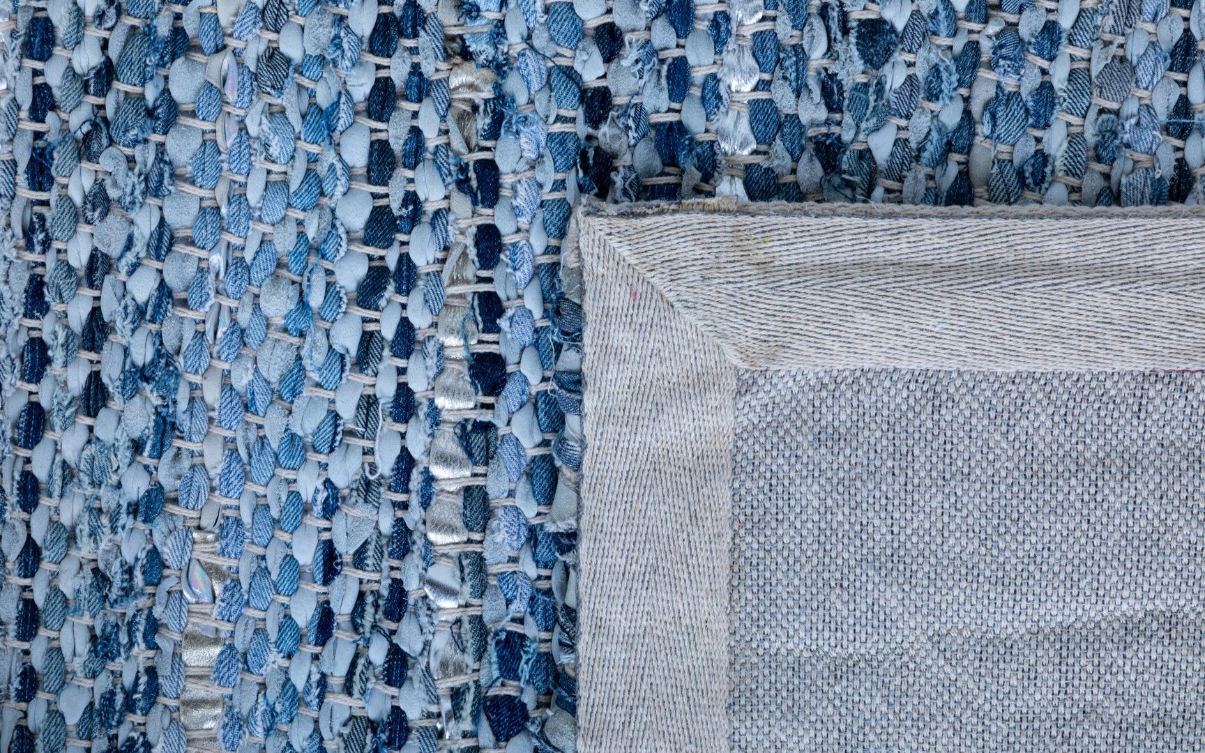 Rustic Charm Blue is a hand woven natural jute and leather carpet.  Colour Light Blue and Blue. Sizes 155 X 225, 200 X 290, 240 X 320 and 300 X 400. Fold.