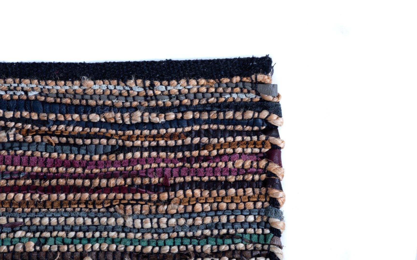 Rustic Charm Multi is a hand woven natural jute and leather carpet.  Colour Black with a multi colour accents. Sizes 155 X 225, 200 X 290, 240 X 320 and 300 X 400. Corner.