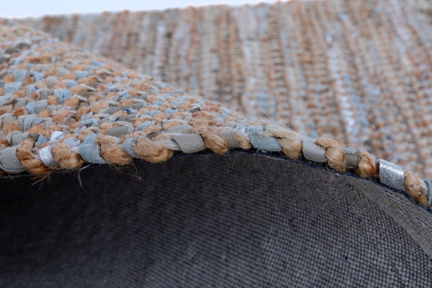 Rustic Charm Natural White is a hand woven natural jute and leather carpet.  Colour Natural Jute with a Blue, beige and grey leather accents. Sizes 200 X 290, 240 X 320 and 300 X 400. Side.