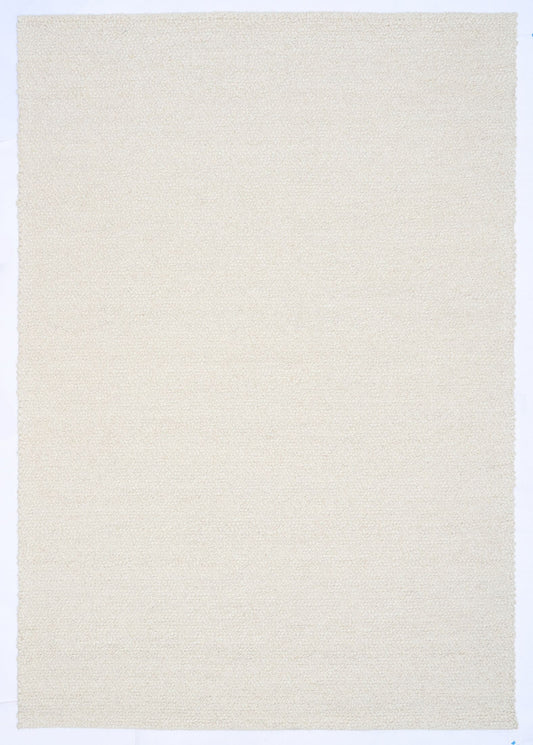 Sahara Ivory Rug – hand woven 100% wool rug in soft neutral tones with a textured finish, available in three sizes, styled for modern and coastal homes. Top.