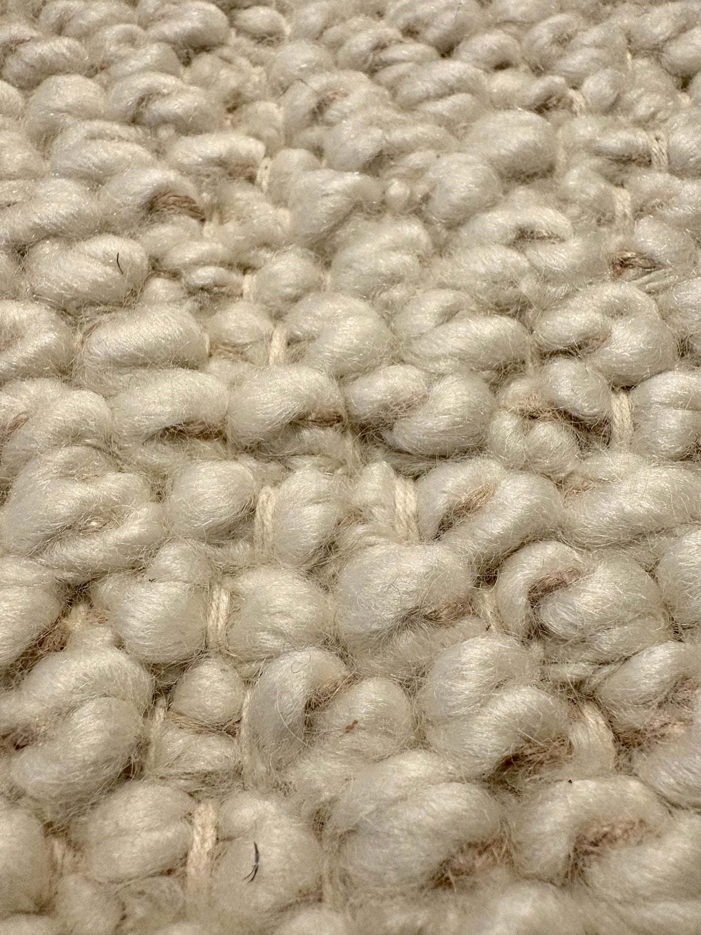 Sahara Ivory Rug – hand woven 100% wool rug in soft neutral tones with a textured finish, available in three sizes, styled for modern and coastal homes. Super Close.