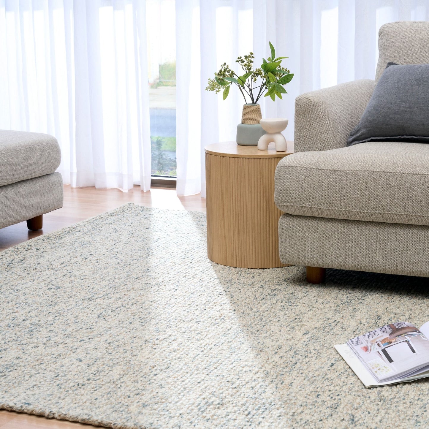 Sahara Teal Rug – hand woven 100% wool rug in soft neutral tones with a textured finish, available in three sizes, styled for modern and coastal homes. Styled.