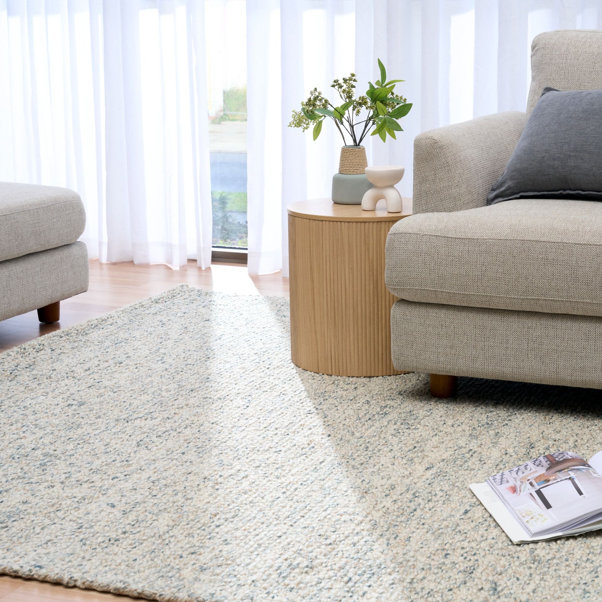 Sahara Teal Rug – hand woven 100% wool rug in soft neutral tones with a textured finish, available in three sizes, styled for modern and coastal homes. Styled.