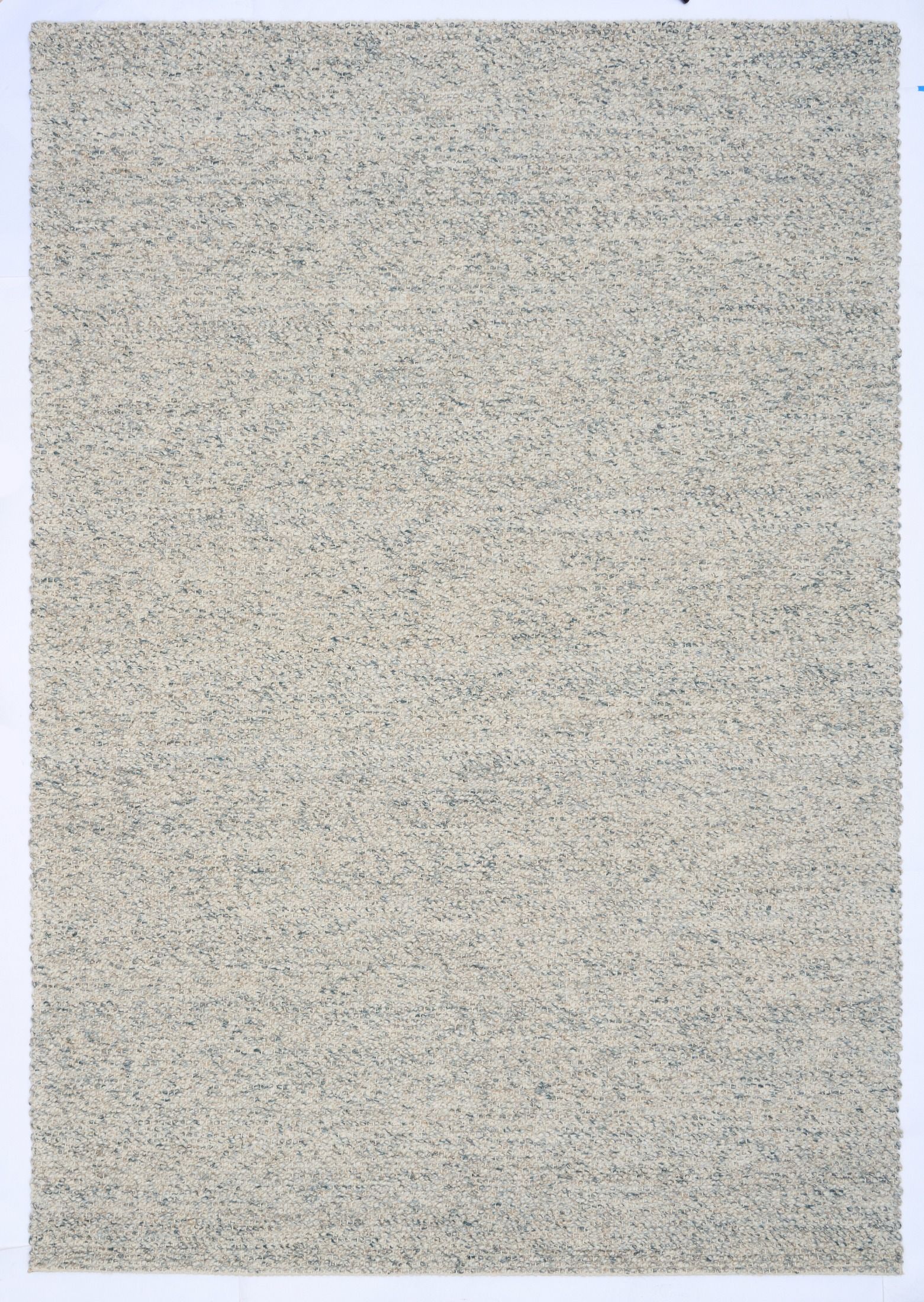 Sahara Teal Rug – hand woven 100% wool rug in soft neutral tones with a textured finish, available in three sizes, styled for modern and coastal homes. Top.