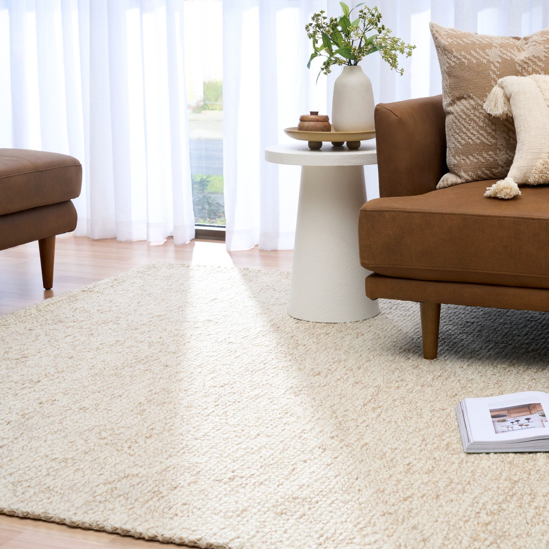 Sahara Wheat Rug – hand woven 100% wool rug in soft neutral tones with a textured finish, available in three sizes, styled for modern and coastal homes. Styled.