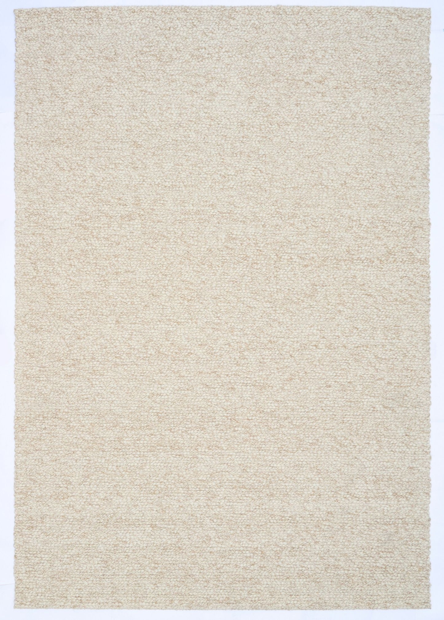 Sahara Wheat Rug – hand woven 100% wool rug in soft neutral tones with a textured finish, available in three sizes, styled for modern and coastal homes. Top.