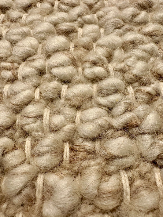 Sahara Wheat Rug – hand woven 100% wool rug in soft neutral tones with a textured finish, available in three sizes, styled for modern and coastal homes. Super Close.