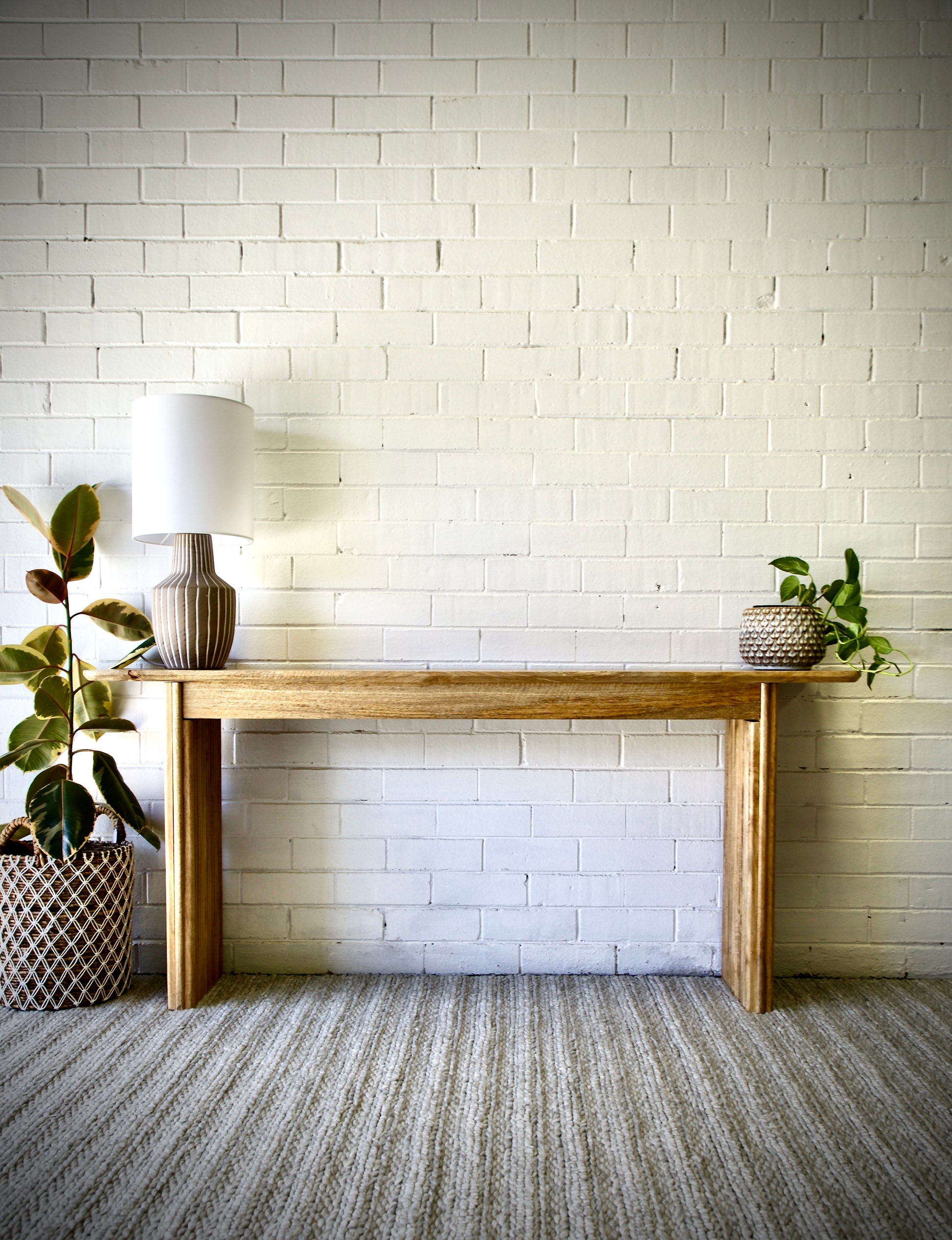 The Salzburg console, stylish and modern, this console is crafted from sustainable fruitwood and features textured legs. Colour natural. Measures 1700 length X 350 depth X 750 height. Front Styled.