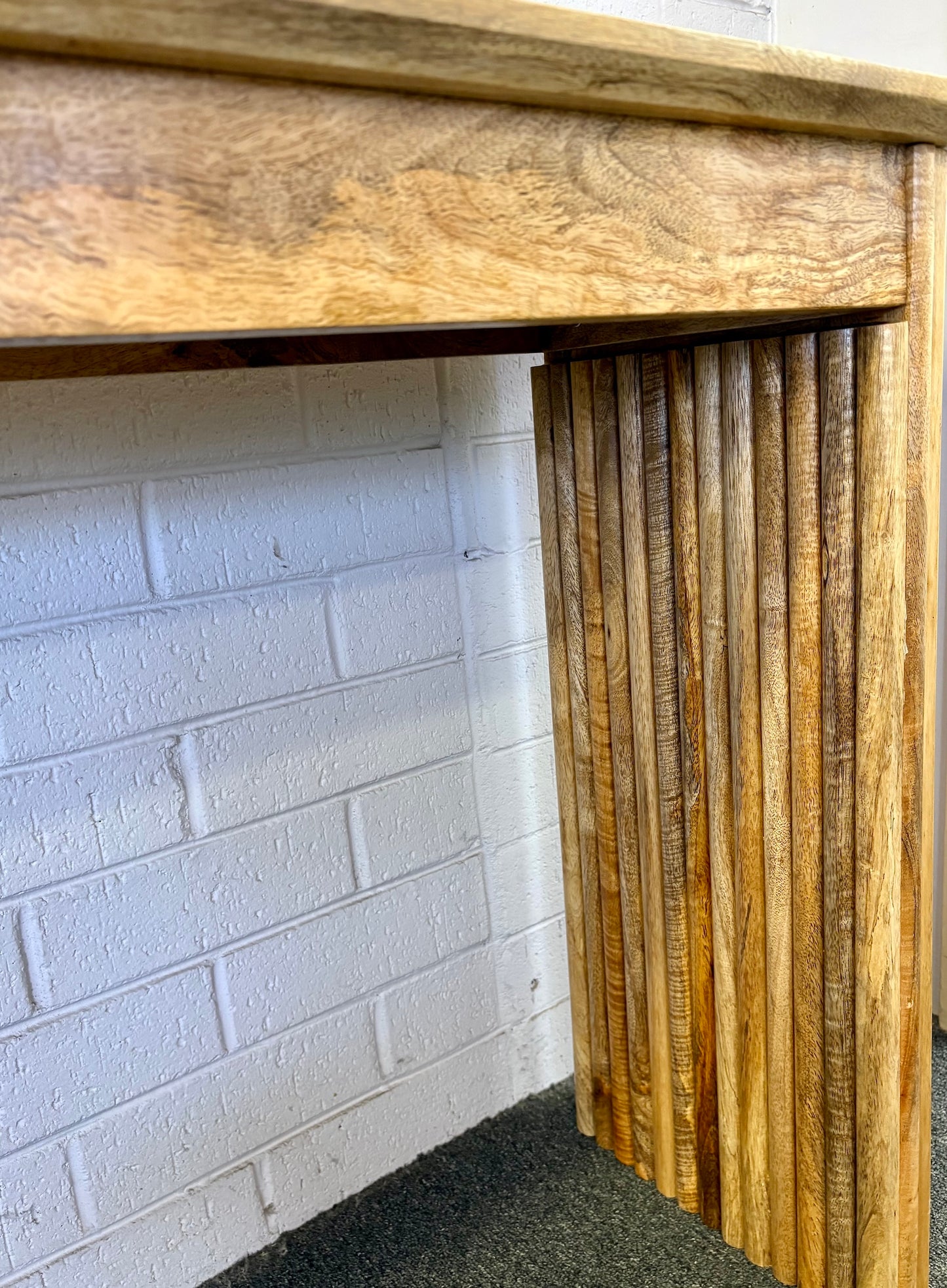 The Salzburg console, stylish and modern, this console is crafted from sustainable fruitwood and features textured legs. Colour natural. Measures 1700 length X 350 depth X 750 height. Angle.