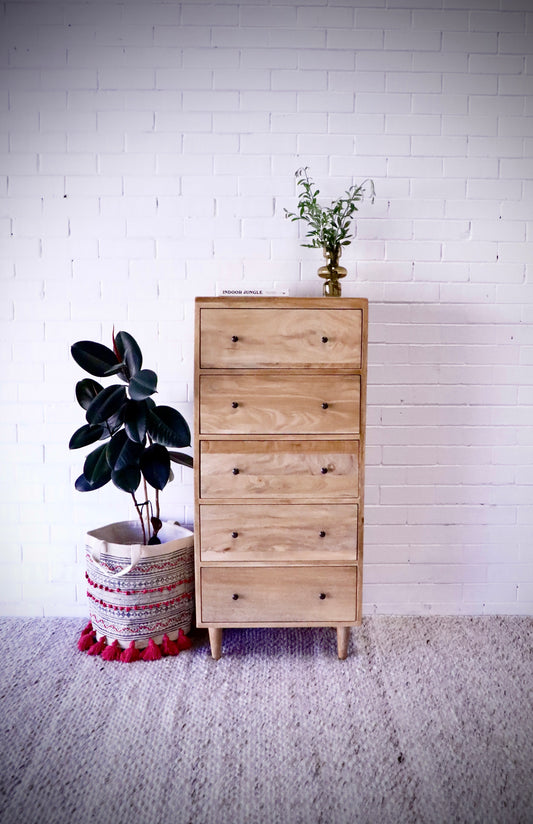 The Sequoia - 5 Drawer features 5 drawers with wooden drawer runners, creating plenty of storage space. Finished in an organic natural colour. Measures 620 wide x 400 depth x 1370 height. Styled.